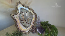 Load and play video in Gallery viewer, Neutral Colored Geode Slice With Genuine Crystal Quartz